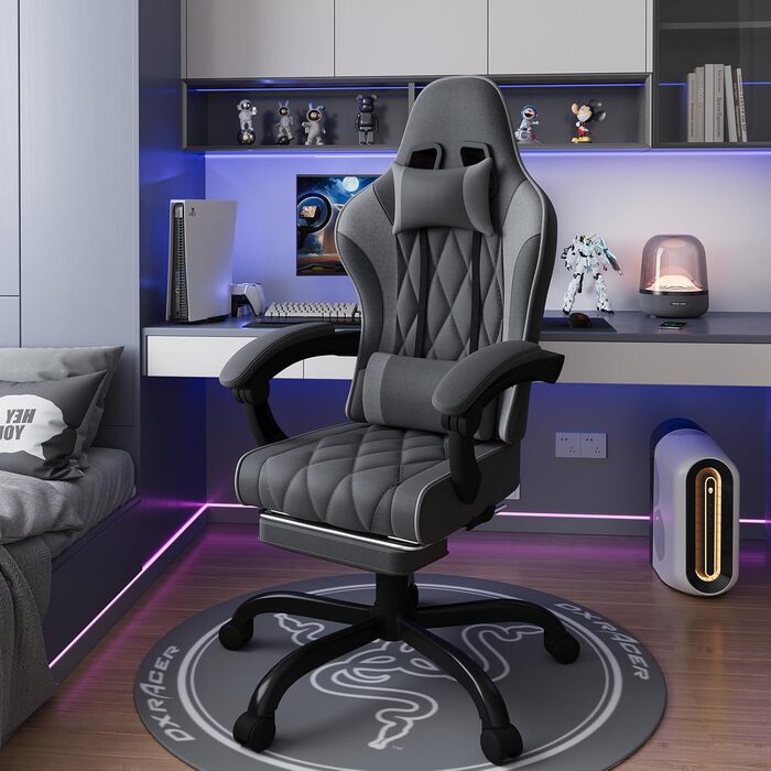 Ігровий крісло JUMMICO з тканини та пружинним наповнювачем, ергономічний офісний крісло з масажером. Крісло має підголівник, підставку для ніг, регулювання висоти. Максимальне навантаження: 150 кг. Колір: темно-сірий