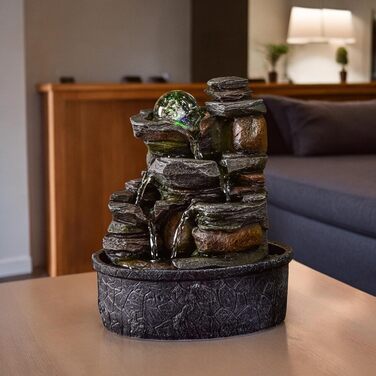 Джерело води Zen'Light від Zimmerbrunnen: природний водоспад з ефектом каменів та кольоровим LED-підсвічуванням. Ідеальна декор для дому, медитації та релаксації. Об'єкт Фен-Шуй для щастя. Висота 23 см (Satya)