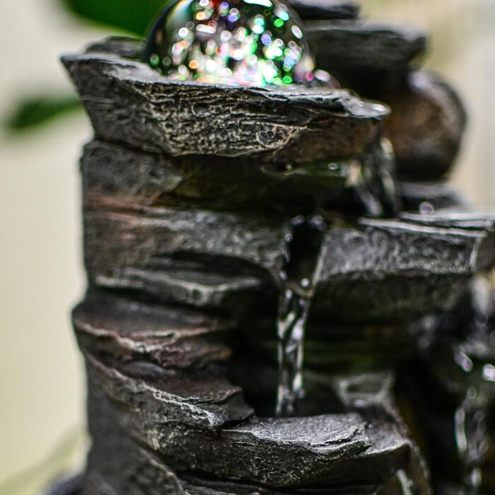 Джерело води Zen'Light від Zimmerbrunnen: природний водоспад з ефектом каменів та кольоровим LED-підсвічуванням. Ідеальна декор для дому, медитації та релаксації. Об'єкт Фен-Шуй для щастя. Висота 23 см (Satya)