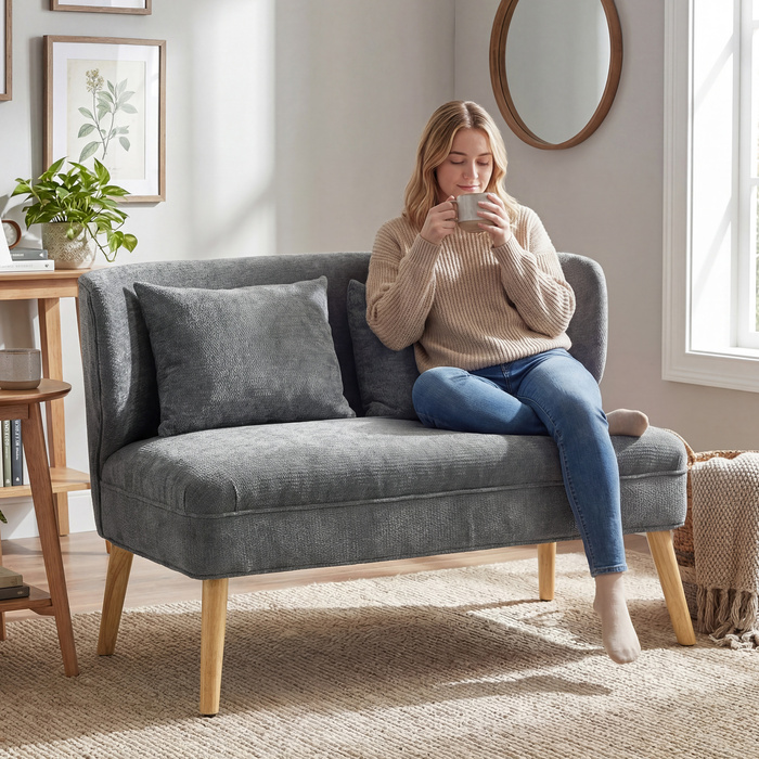 Диван на двох місцях, компактний диван з велюровою оббивкою та крилами, з м'яким сидінням та ніжками з масиву гевеї, сірого кольору.
